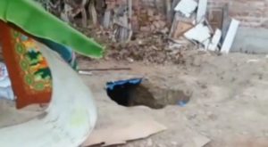 Encuentran cadáver de joven madre en silo de vivienda de Asia